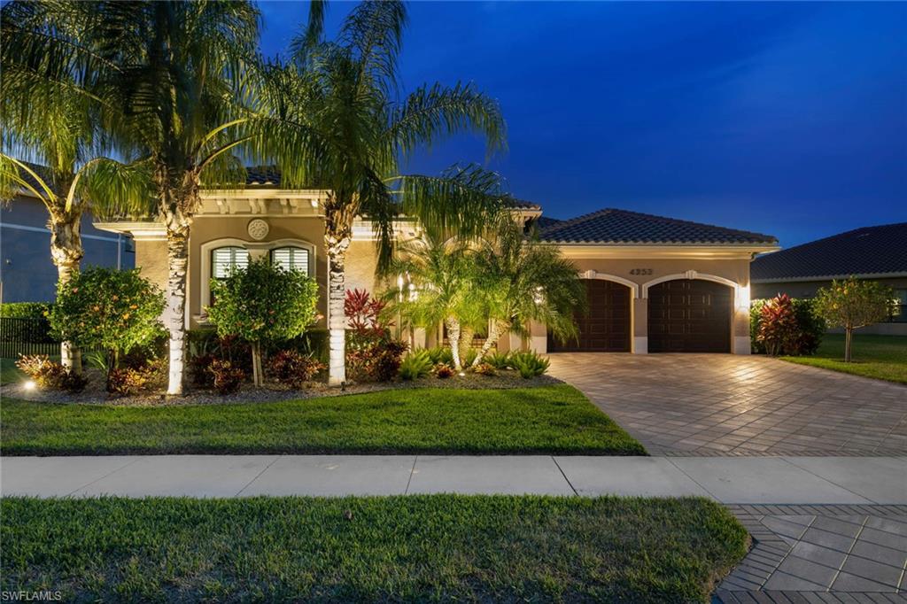 4353 Caldera Circle Naples, FL 34119 - Photo 38 of 40 a front view of a house with a yard