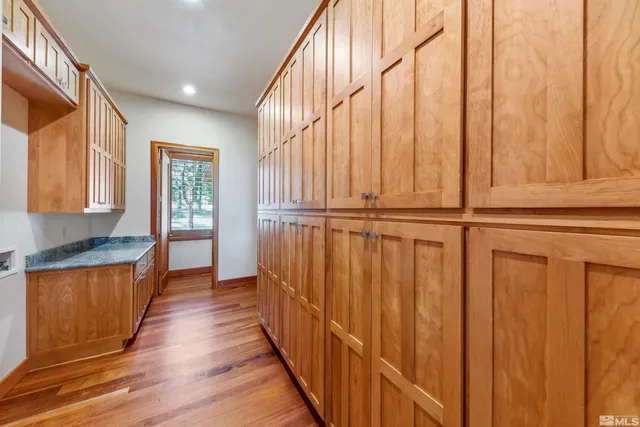 a view of a porch with wooden floor and staircase