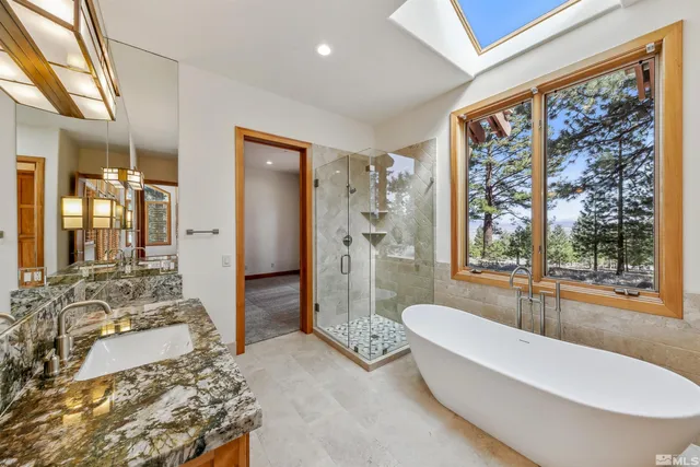 a bathroom with a tub and shower