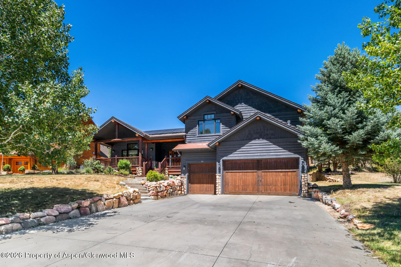 316 Faas Ranch Road New Castle, CO 81647 - Photo 3 of 50 a front view of a house with a yard