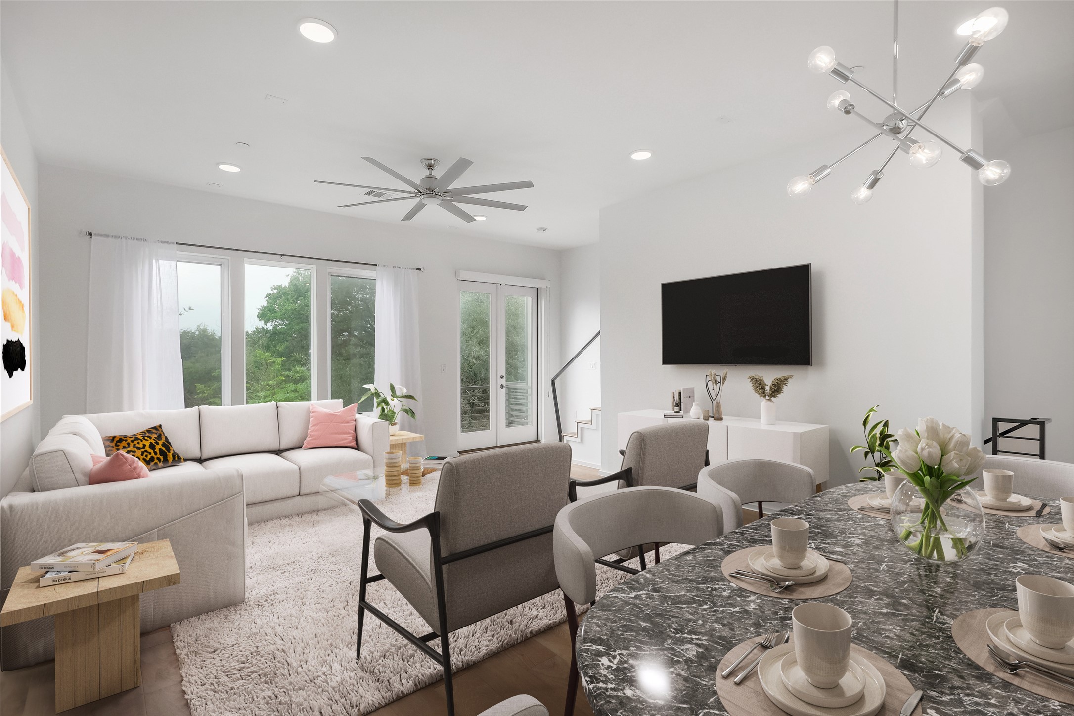 a living room with furniture and a flat screen tv