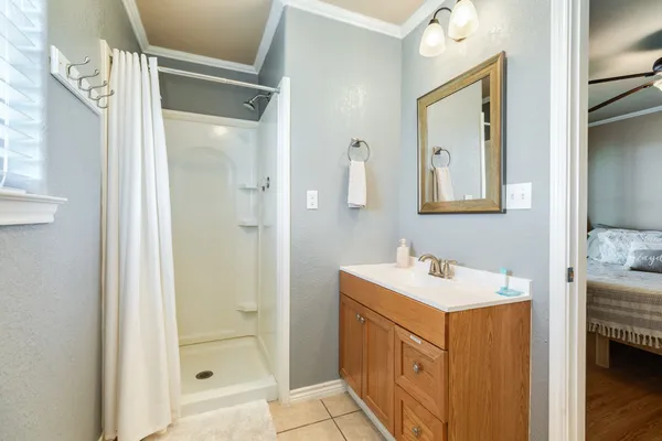 a bathroom with a sink mirror vanity and toilet