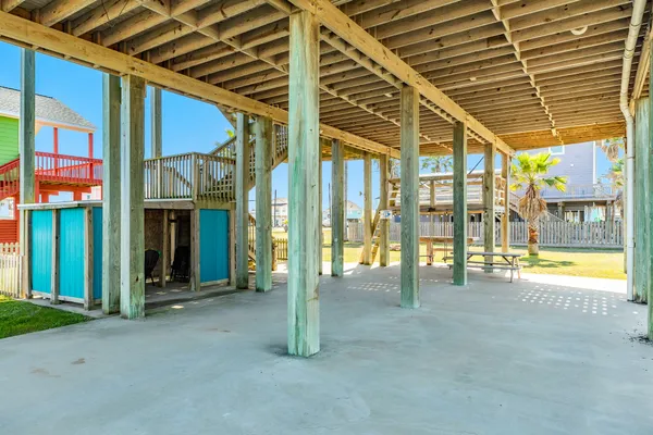 a view of a house with swimming pool and sitting area