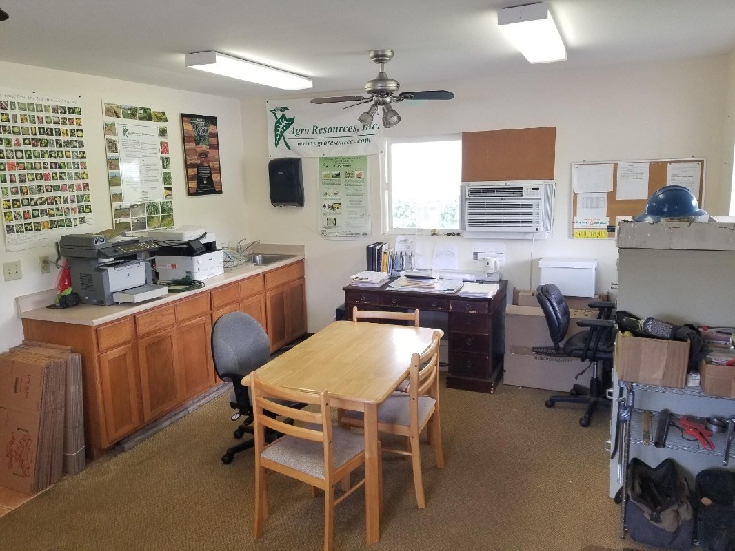 2 Kaiwiki Road Hilo, HI 96720 - Photo 7 of 8 a dining room with a table chairs and a kitchen view