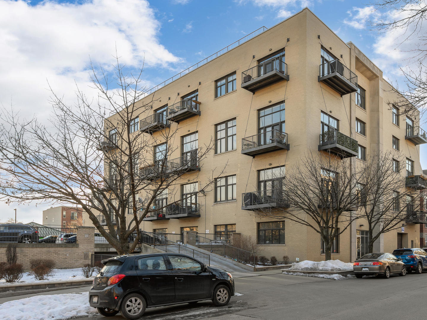 a view of a car parked in front of a building