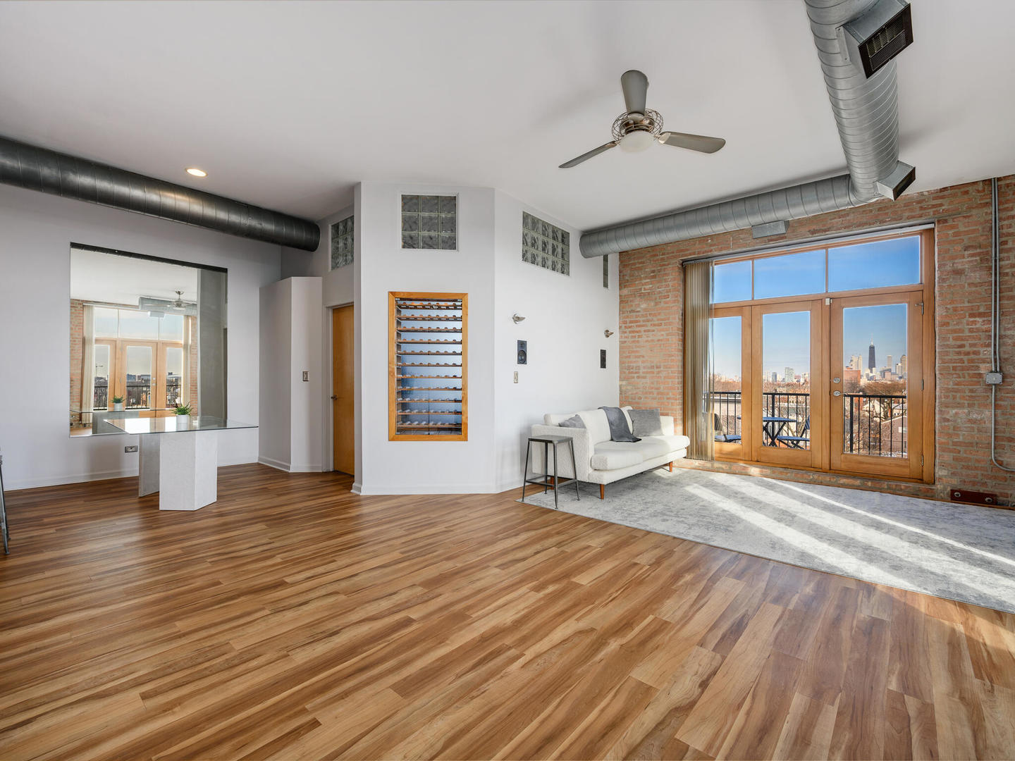 2101 West Rice Street, Unit 408 Chicago, IL 60622 - Photo 6 of 12 a spacious bedroom with a bed and a large window