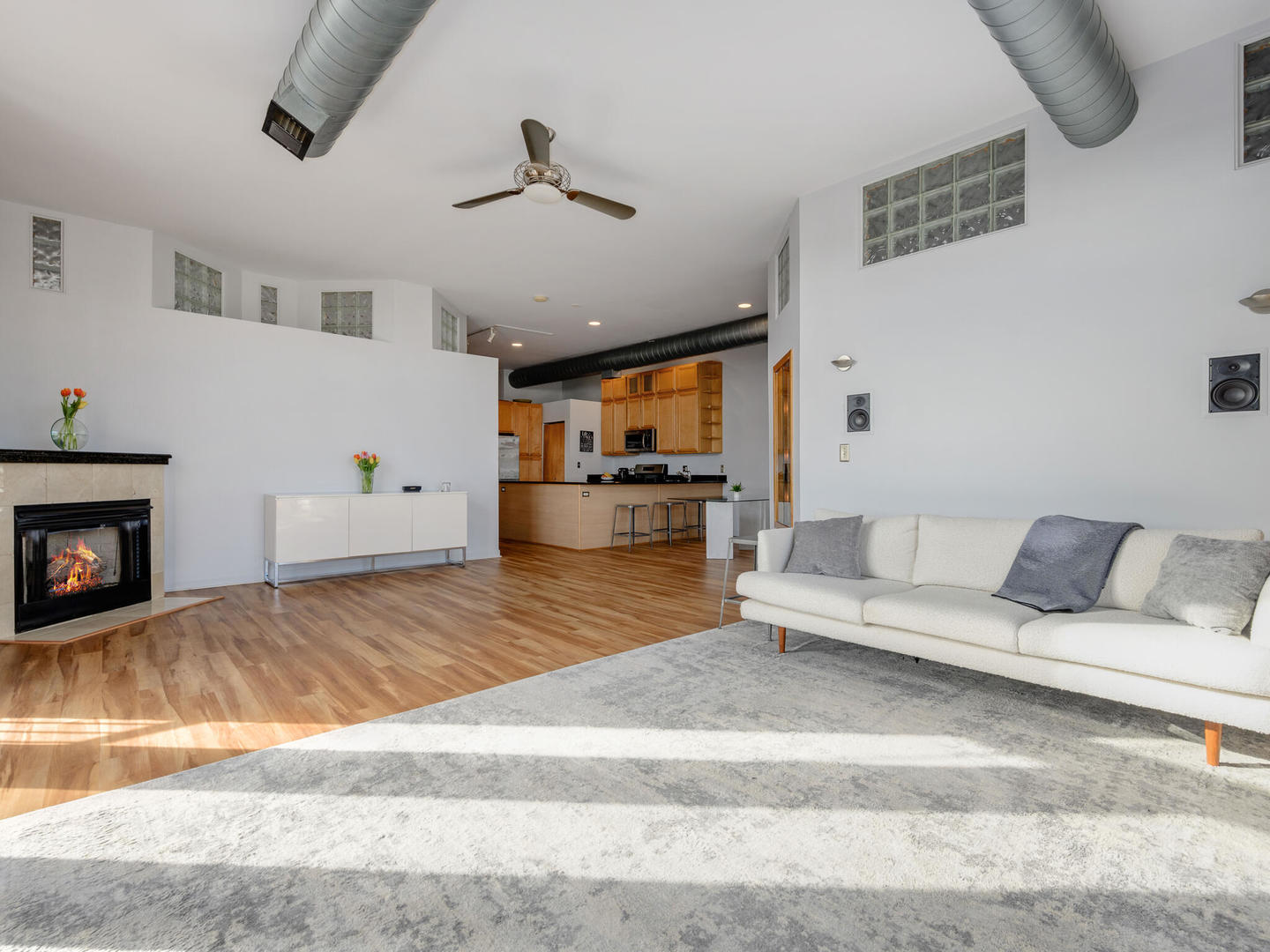 2101 West Rice Street, Unit 408 Chicago, IL 60622 - Photo 7 of 12 a living room with furniture and a fireplace