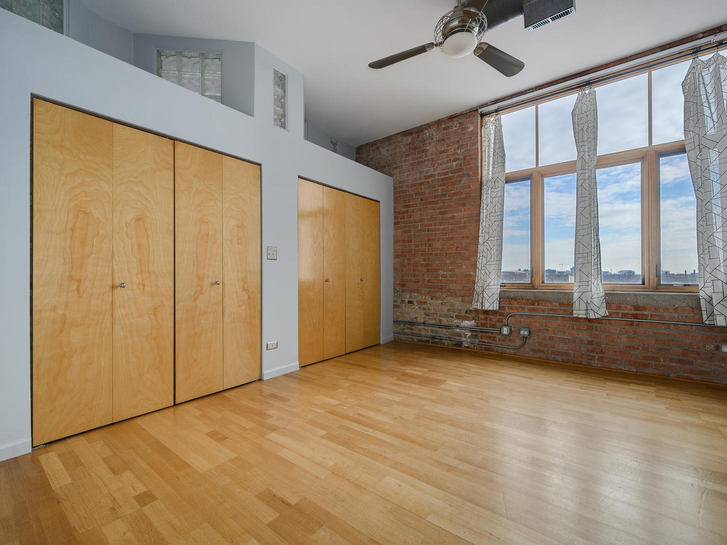 2101 West Rice Street, Unit 408 Chicago, IL 60622 - Photo 8 of 12 a view of an empty room with a window