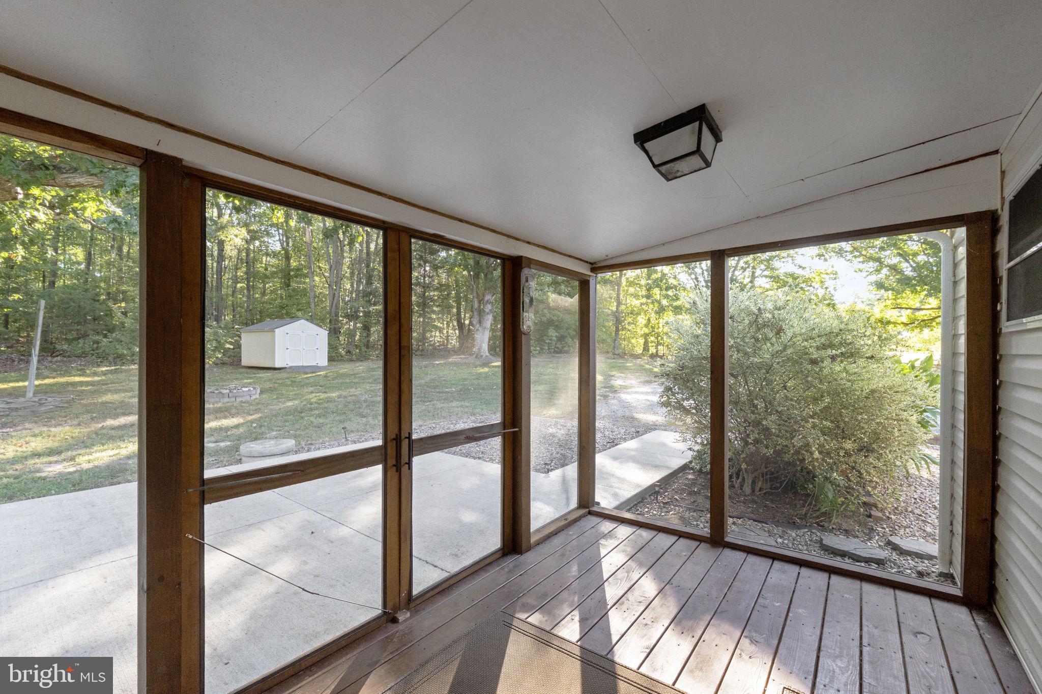 20455 Monrovia Road Orange, VA 22960 - Photo 18 of 41 a view of a room with wooden floor and doors