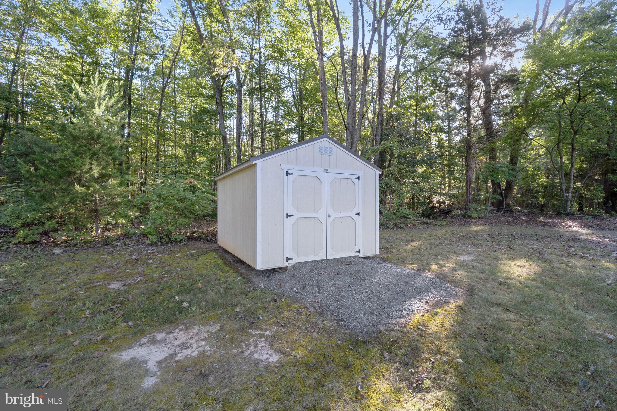 20455 Monrovia Road Orange, VA 22960 - Photo 22 of 41 a view of a house with large trees and plants
