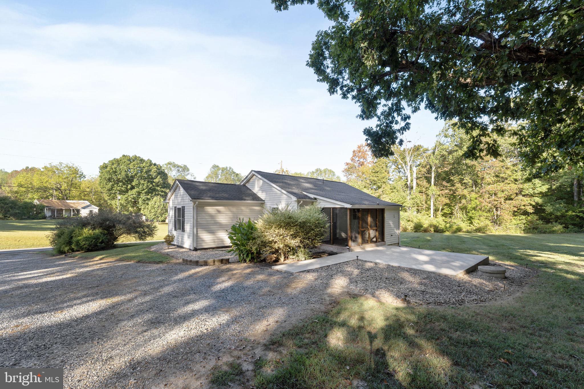 20455 Monrovia Road Orange, VA 22960 - Photo 25 of 41 a view of a house with a yard and large trees