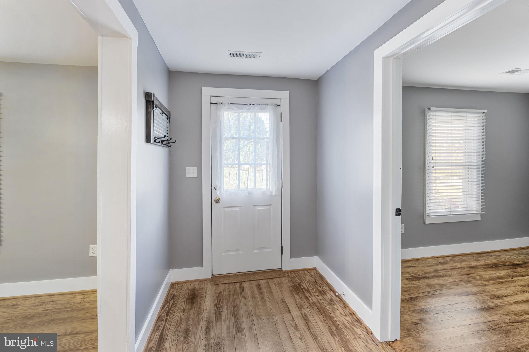 20455 Monrovia Road Orange, VA 22960 - Photo 3 of 41 a view of hallway with window and wooden floor