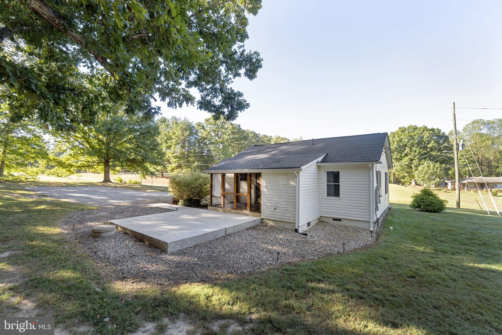20455 Monrovia Road Orange, VA 22960 - Photo 33 of 41 a backyard of a house with table and chairs