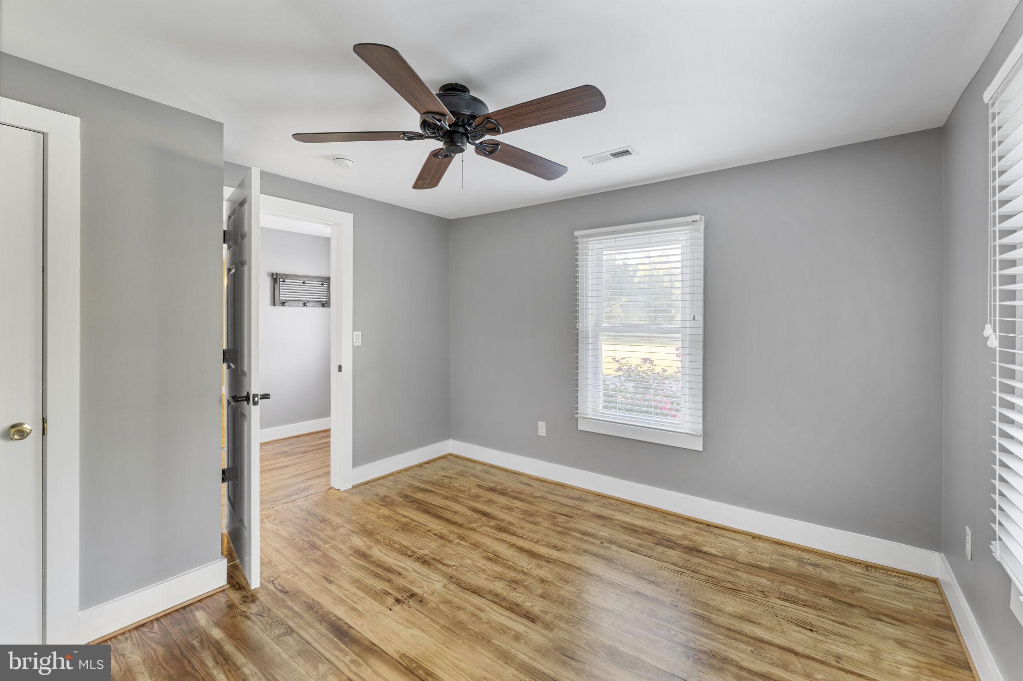 20455 Monrovia Road Orange, VA 22960 - Photo 5 of 41 a view of a big room with wooden floor and windows in a room