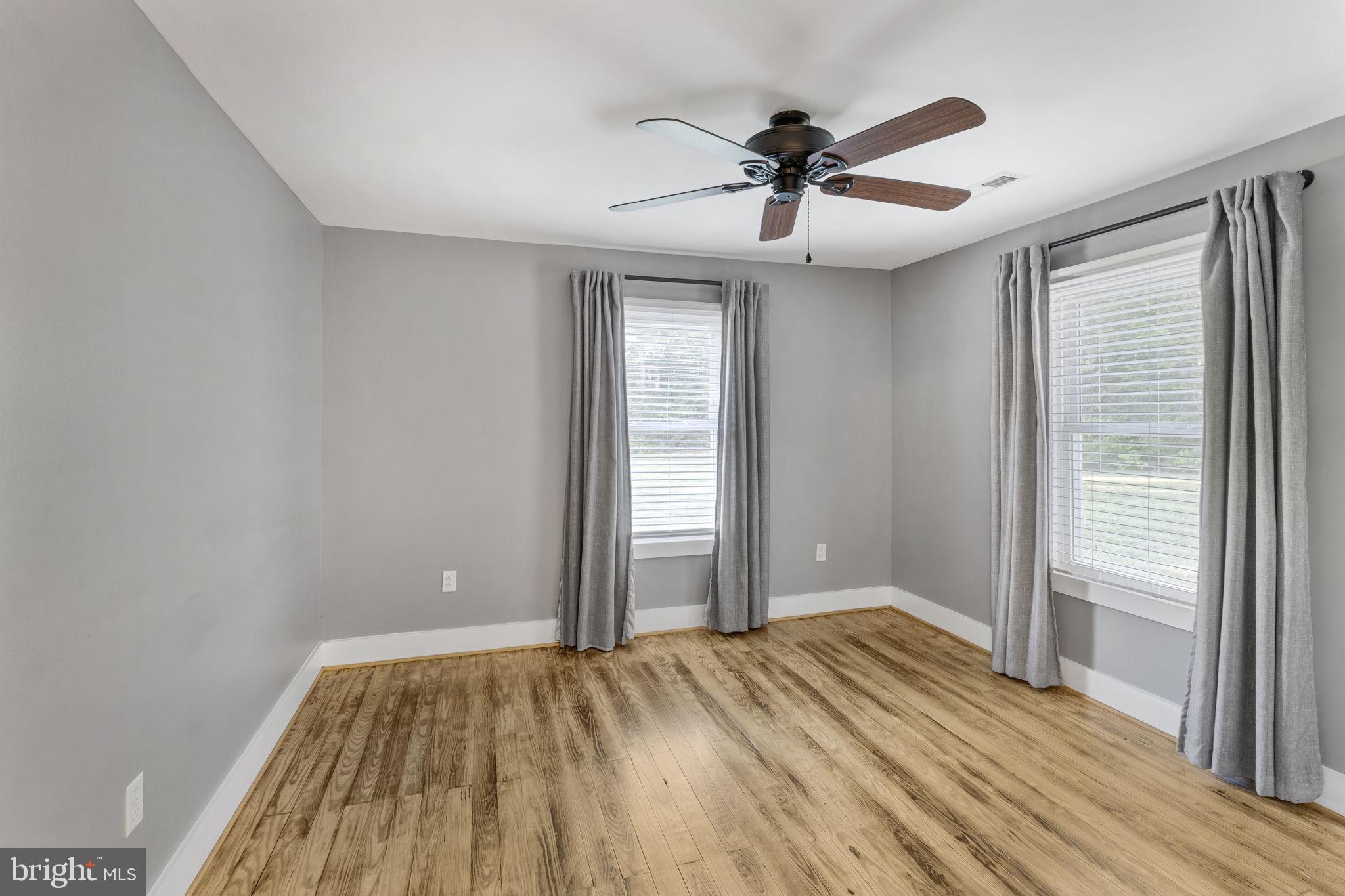 20455 Monrovia Road Orange, VA 22960 - Photo 6 of 41 a view of empty room with wooden floor and fan