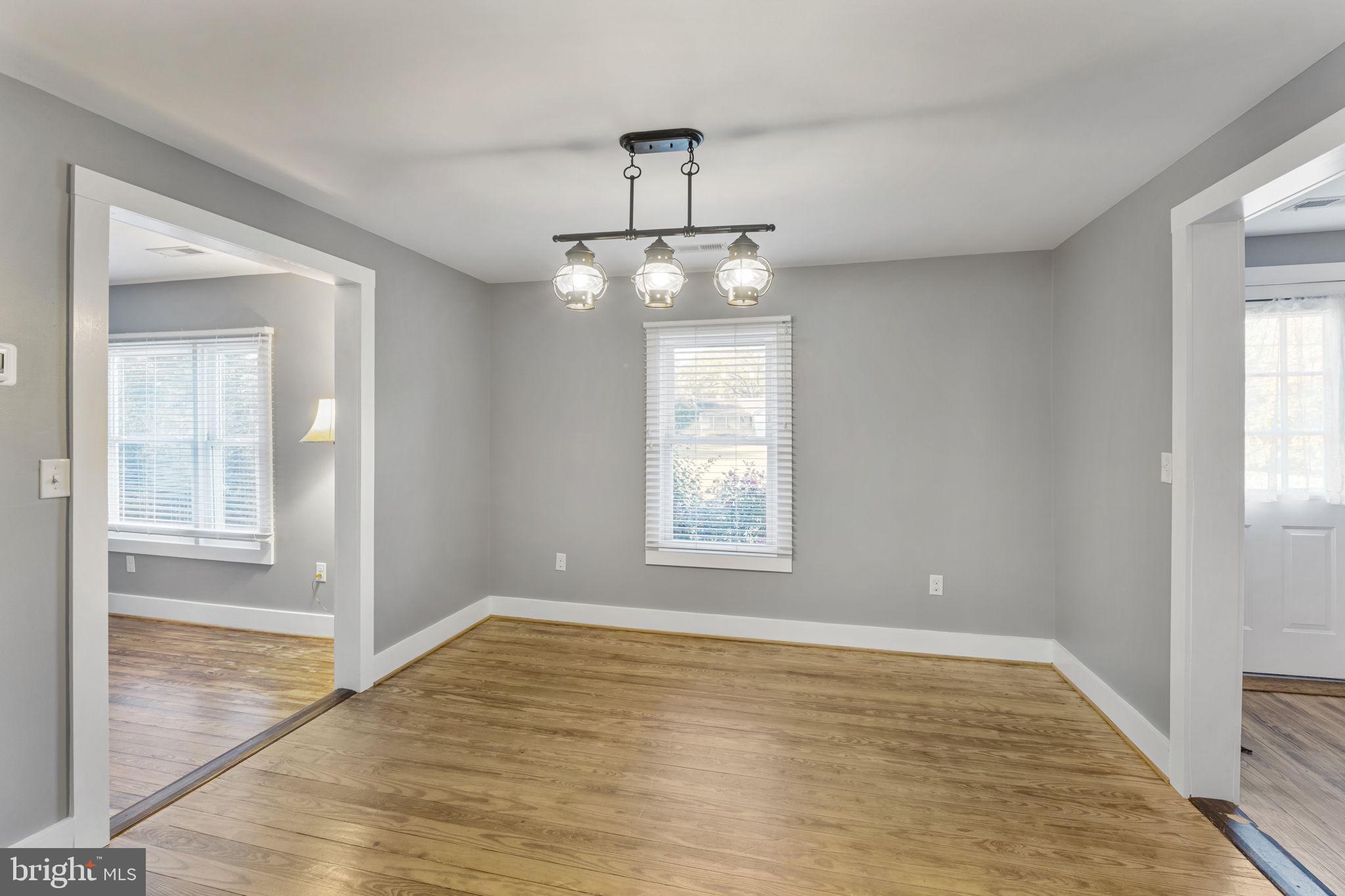 20455 Monrovia Road Orange, VA 22960 - Photo 9 of 41 a view of an empty room with wooden floor and a window