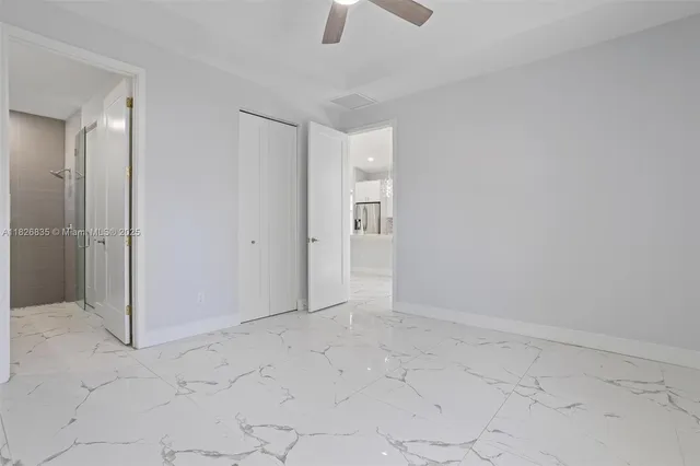 a view of a bathroom with a shower and a sink