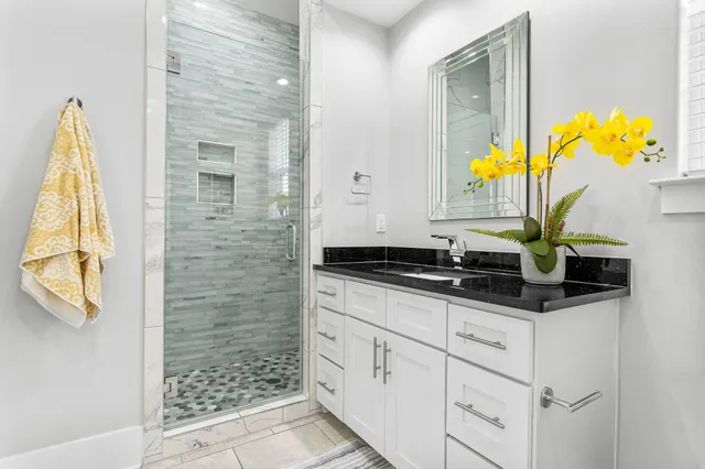 a kitchen with stainless steel appliances a sink a counter space and a window