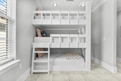 a view of staircase with white walls and a window