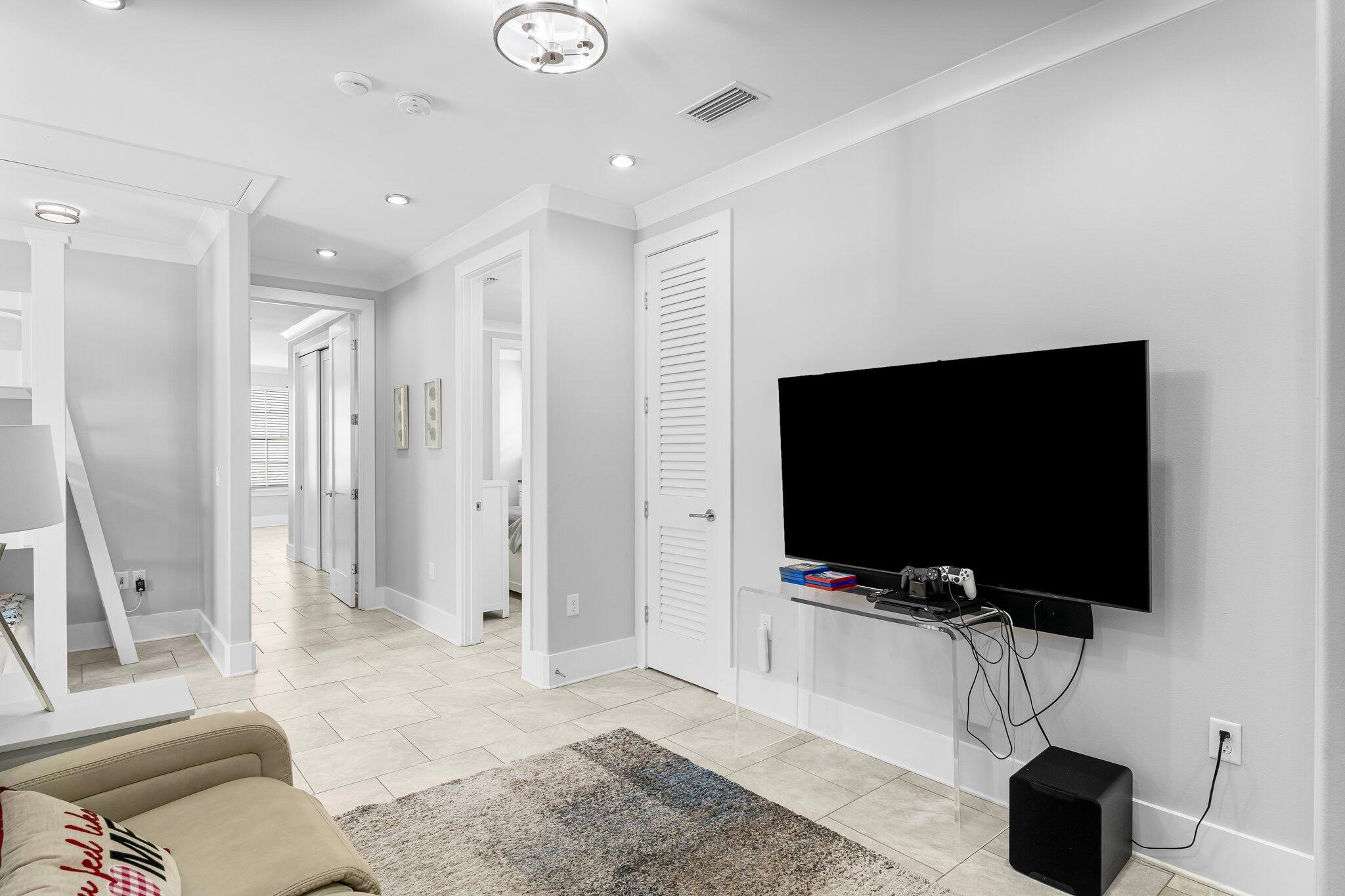 1955 Baytowne Loop Miramar Beach, FL 32550 - Photo 24 of 51 a living room with a flat screen tv and a view of living room