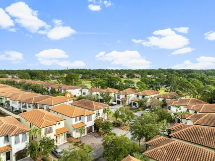 an aerial view of residential houses with outdoor space