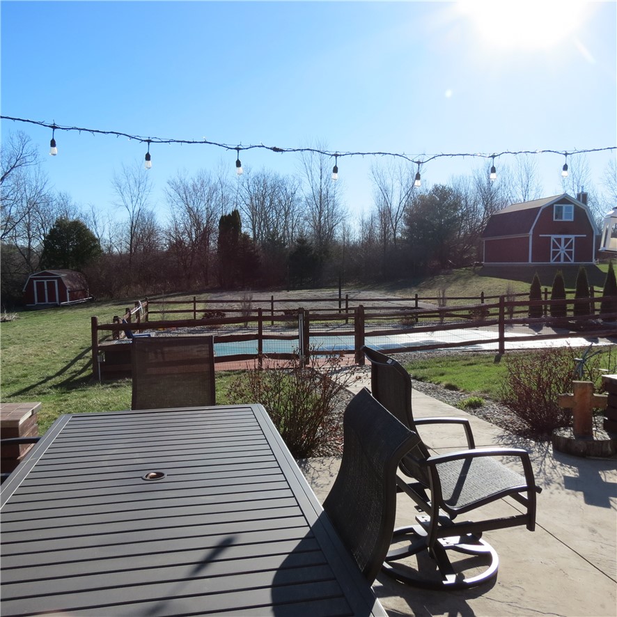 10160 Lochard Road Sidney, OH 45365 - Photo 34 of 41 Enjoy the expansive outdoor living space with dedicated areas for recreation and relaxation.