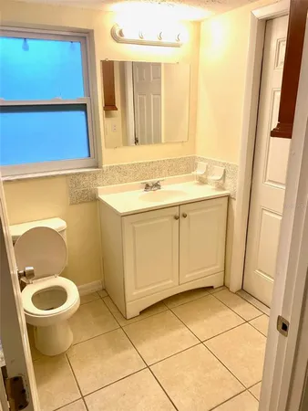 a bathroom with a sink and a washing machine