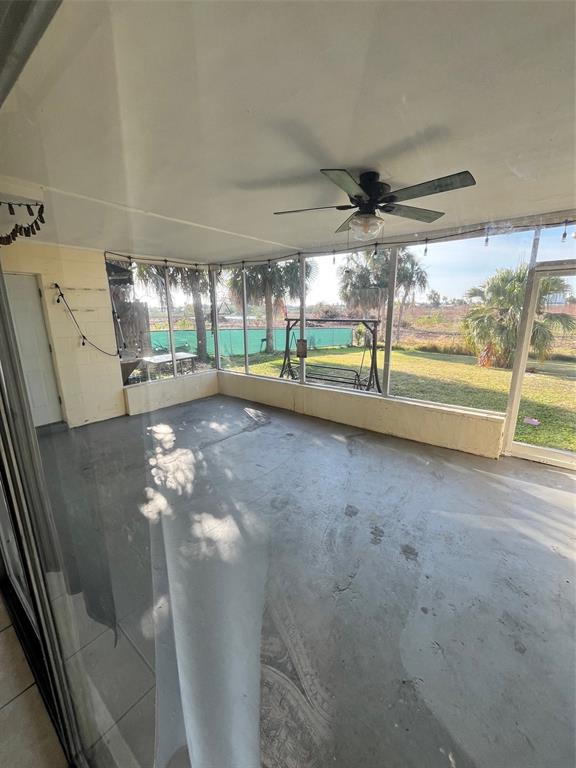 3906 Headsail Drive New Port Richey, FL 34652 - Photo 20 of 21 en empty room with floor to ceiling window and outdoor view