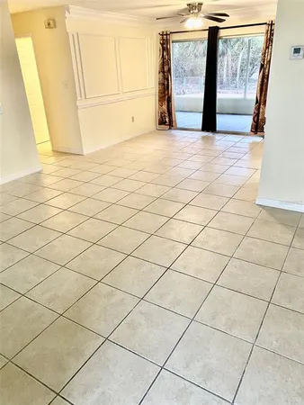 a view of room with a window and mirror