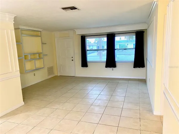 a view of an empty room with glass door