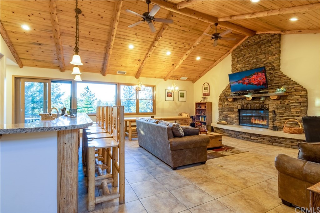 43490 Primrose Drive Big Bear Lake, CA 92315 - Photo 7 of 69 a living room with fireplace furniture and a large window