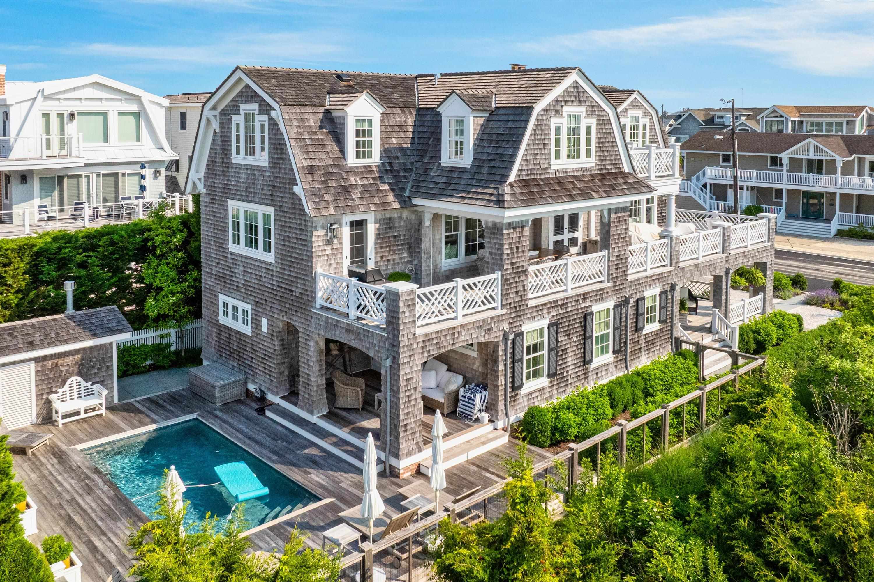 74 38th Street Avalon, NJ 08202 - Photo 1 of 50 a view of a house with a swimming pool