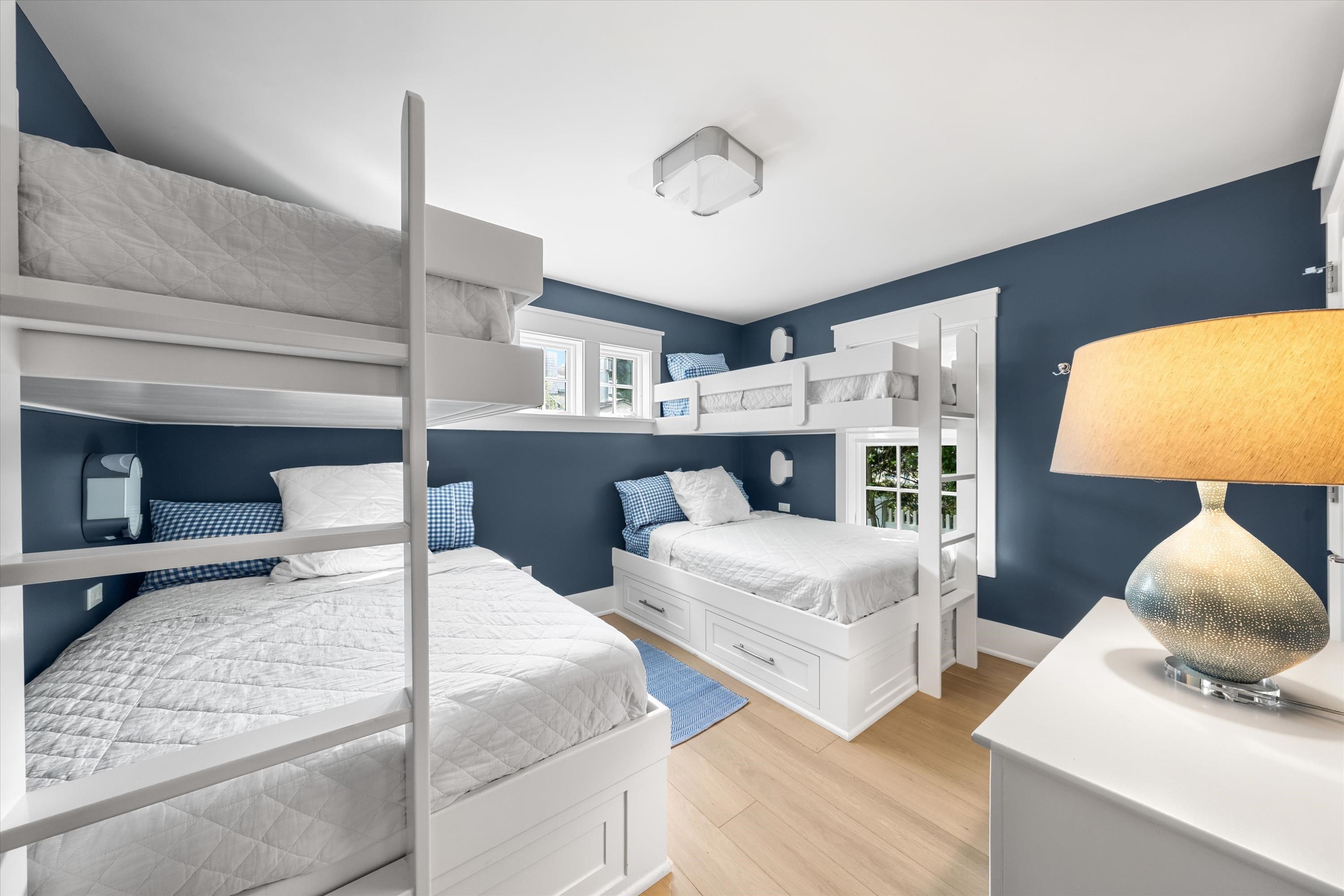 74 38th Street Avalon, NJ 08202 - Photo 16 of 50 a bedroom with a bed and a lamp