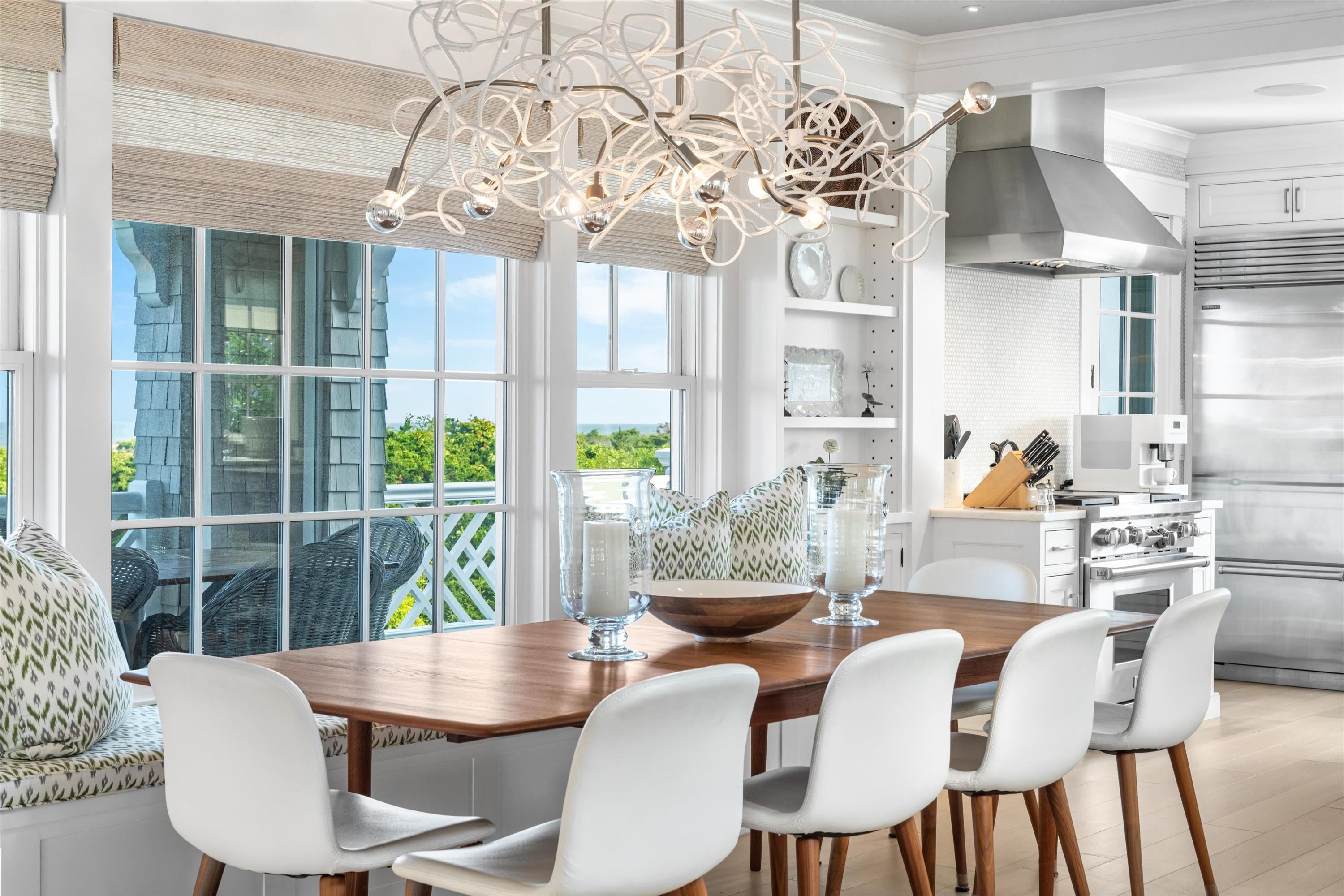 74 38th Street Avalon, NJ 08202 - Photo 19 of 50 a view of a dining room with furniture wooden floor and chandelier