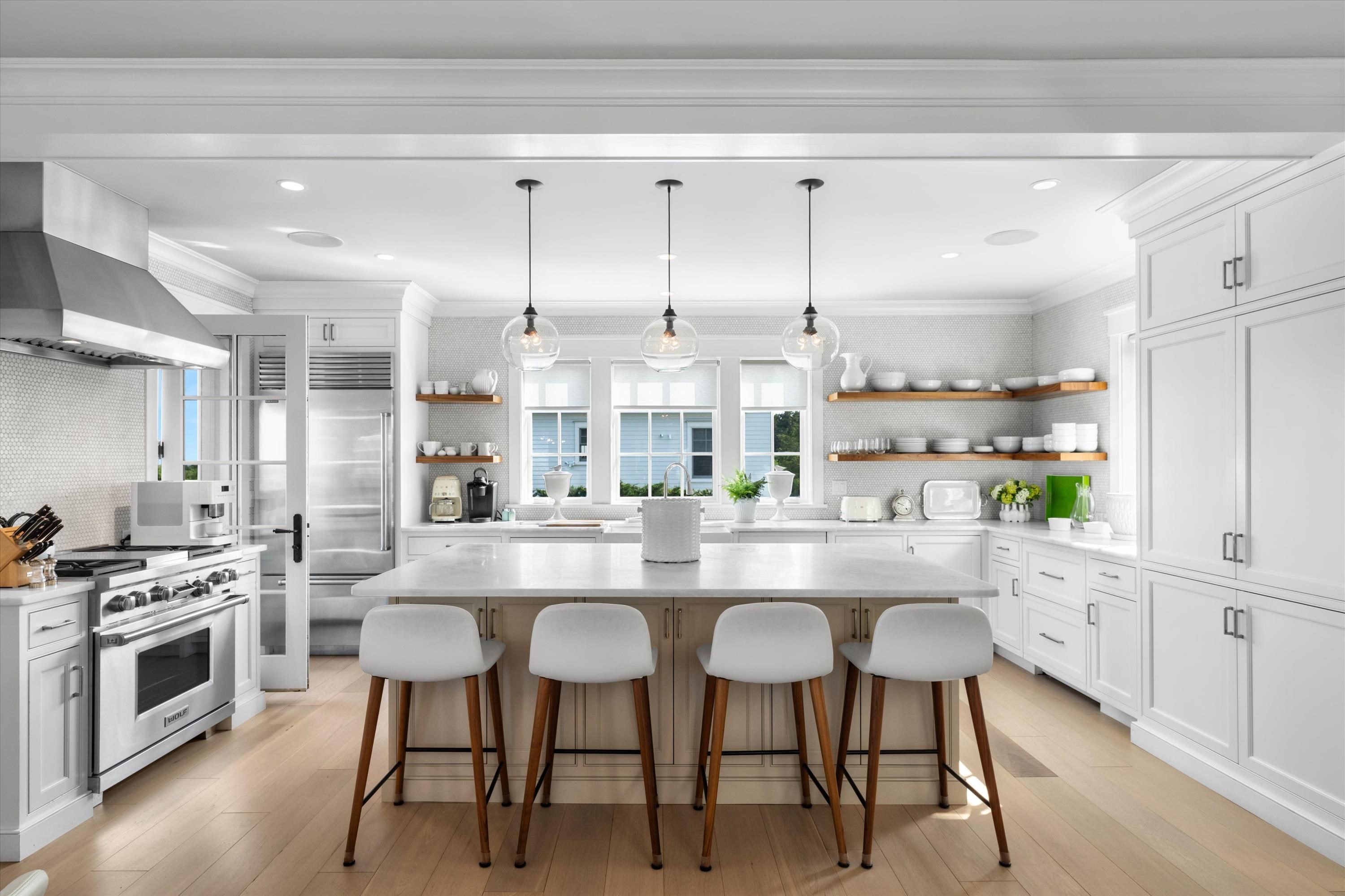 74 38th Street Avalon, NJ 08202 - Photo 21 of 50 a kitchen with kitchen island granite countertop a sink cabinets and stainless steel appliances