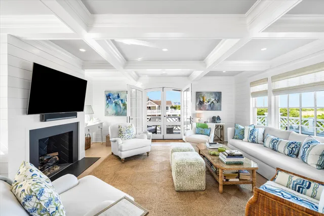 a living room with furniture fireplace and flat screen tv