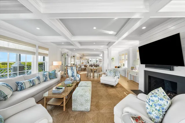 a living room with fireplace furniture and a flat screen tv