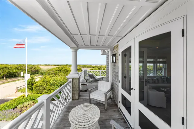 a view of a balcony and chairs
