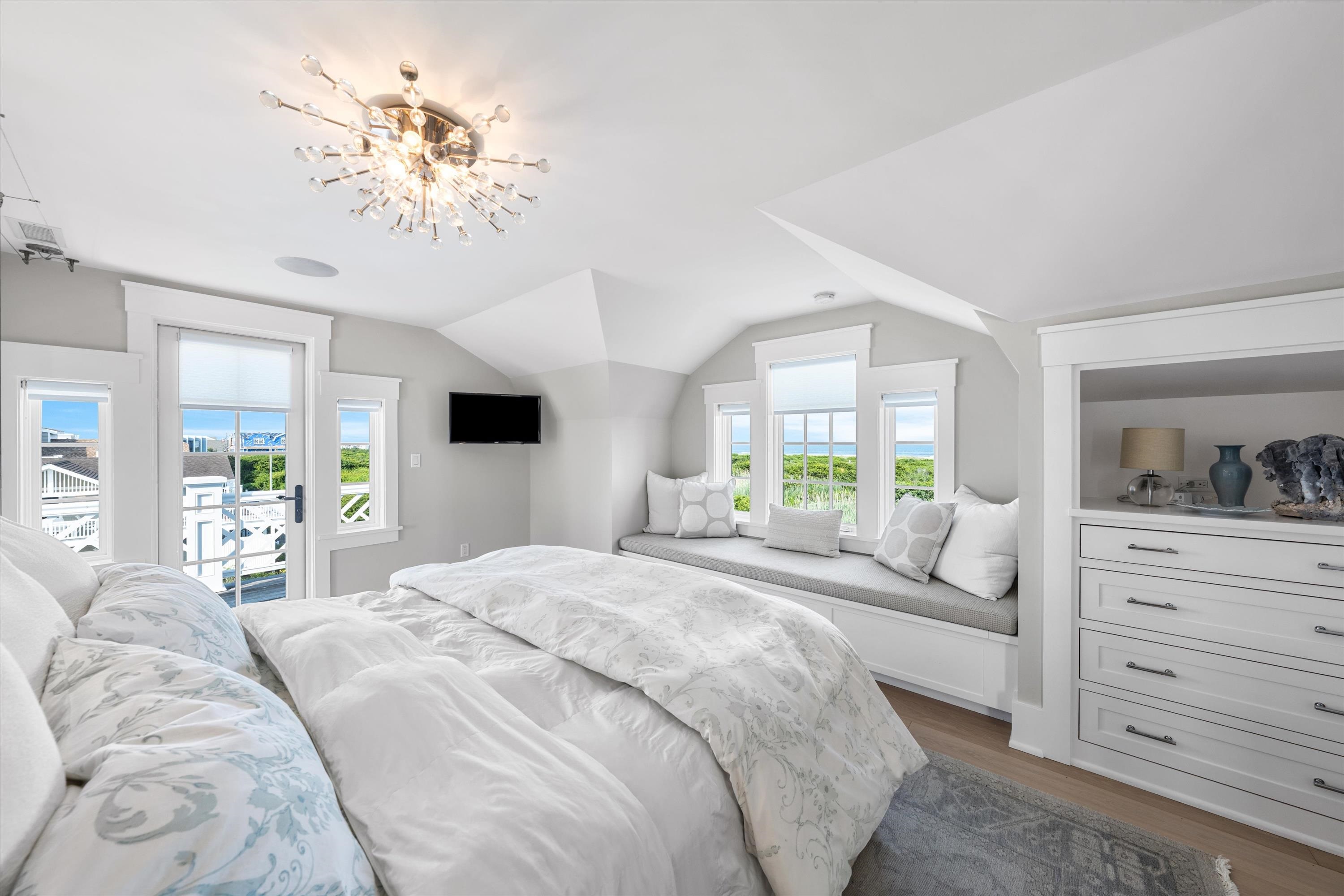 74 38th Street Avalon, NJ 08202 - Photo 36 of 50 a bedroom with a large bed and a window