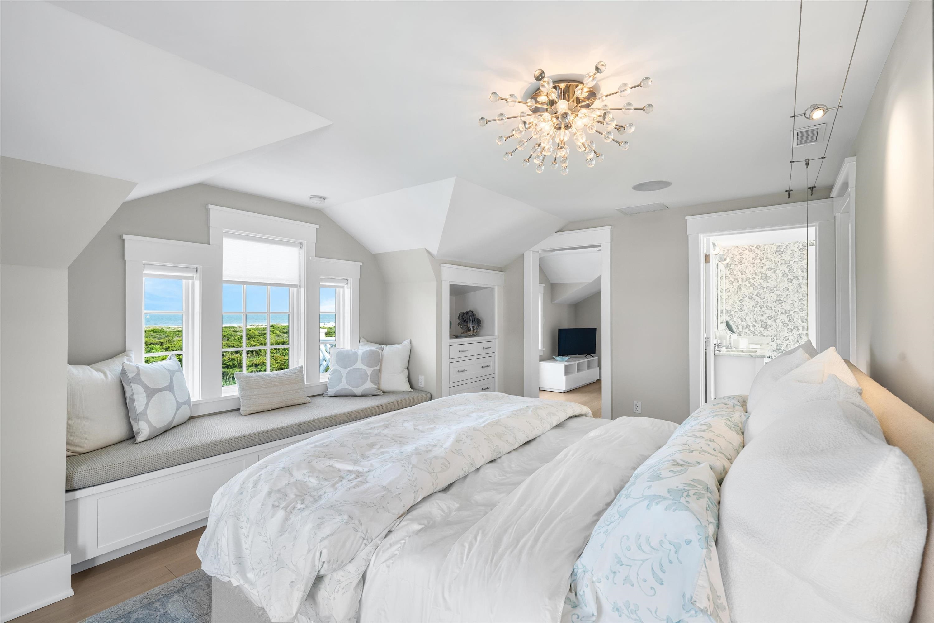 74 38th Street Avalon, NJ 08202 - Photo 37 of 50 a bedroom with a large bed and a large window