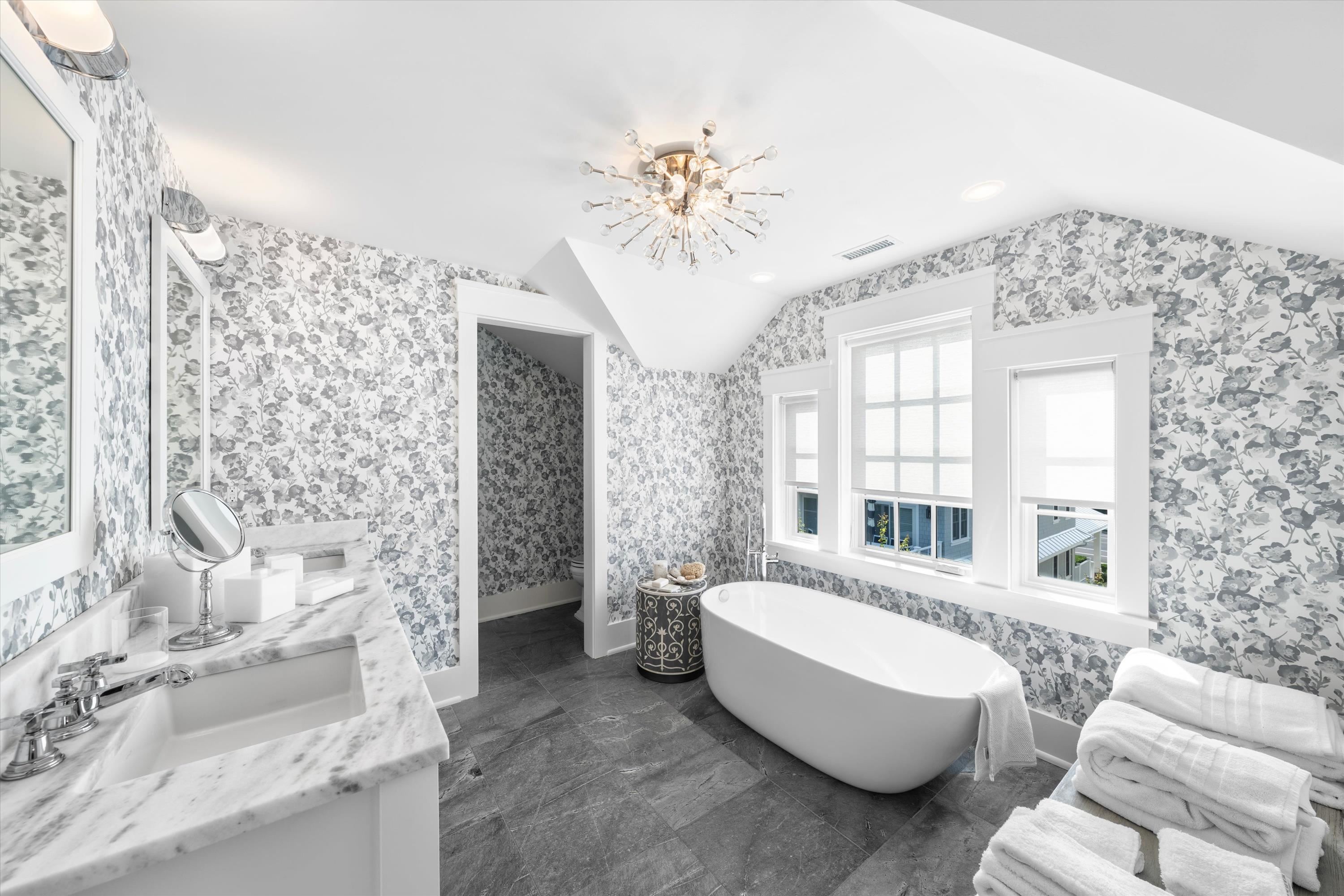 74 38th Street Avalon, NJ 08202 - Photo 38 of 50 a living room with furniture and a chandelier