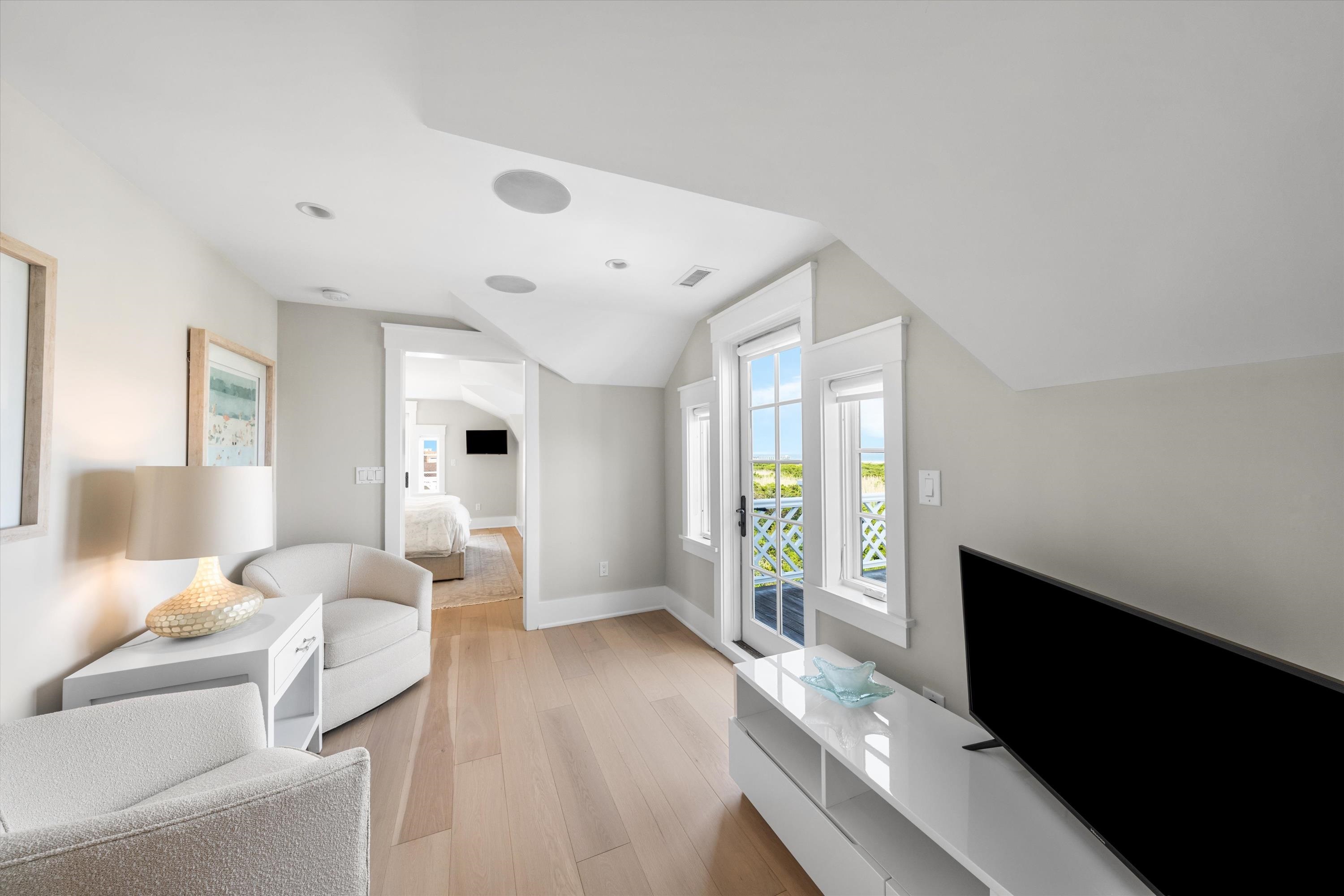 74 38th Street Avalon, NJ 08202 - Photo 40 of 50 a bedroom with furniture and a large window