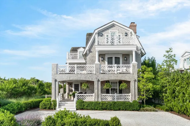 front view of a building with a garden