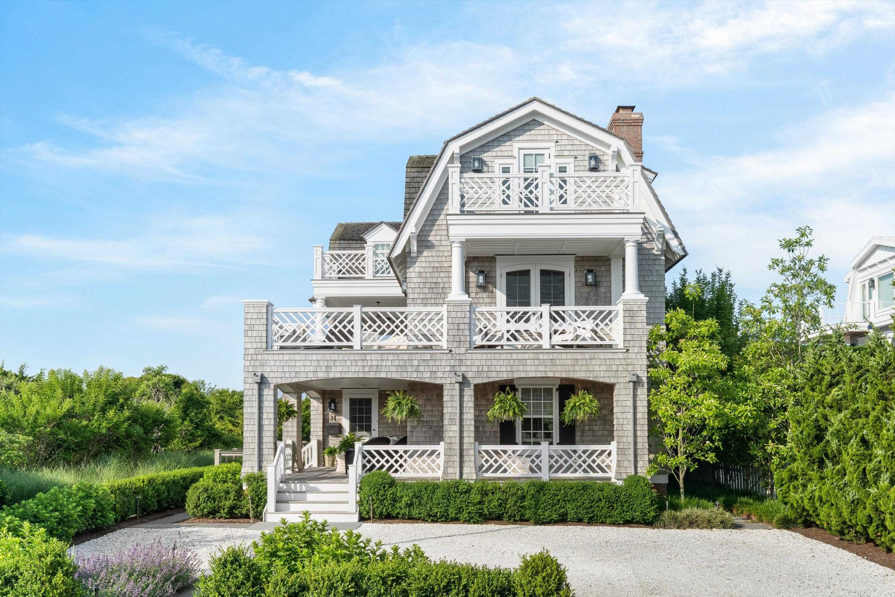 74 38th Street Avalon, NJ 08202 - Photo 4 of 50 front view of a building with a garden