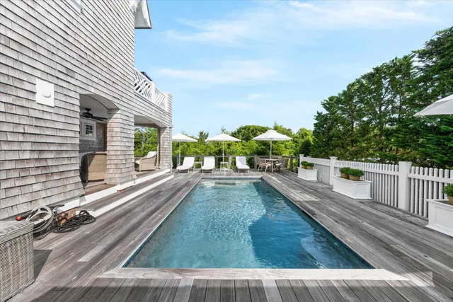 a view of a balcony with yard