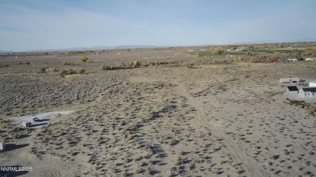 a view of a dry yard with wooden floor