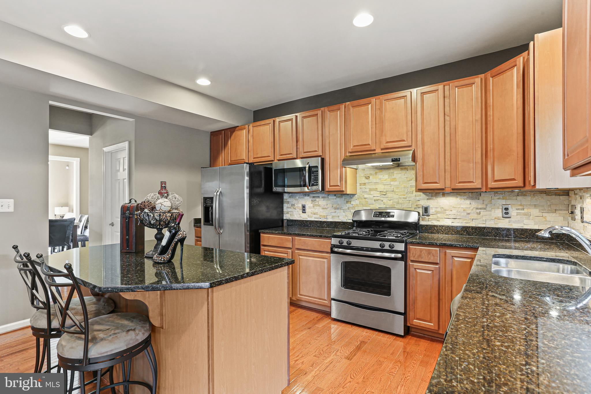 1122 Sassafras Circle Eldersburg, MD 21784 - Photo 9 of 40 Kitchen with hardwood floors and recessed lighting