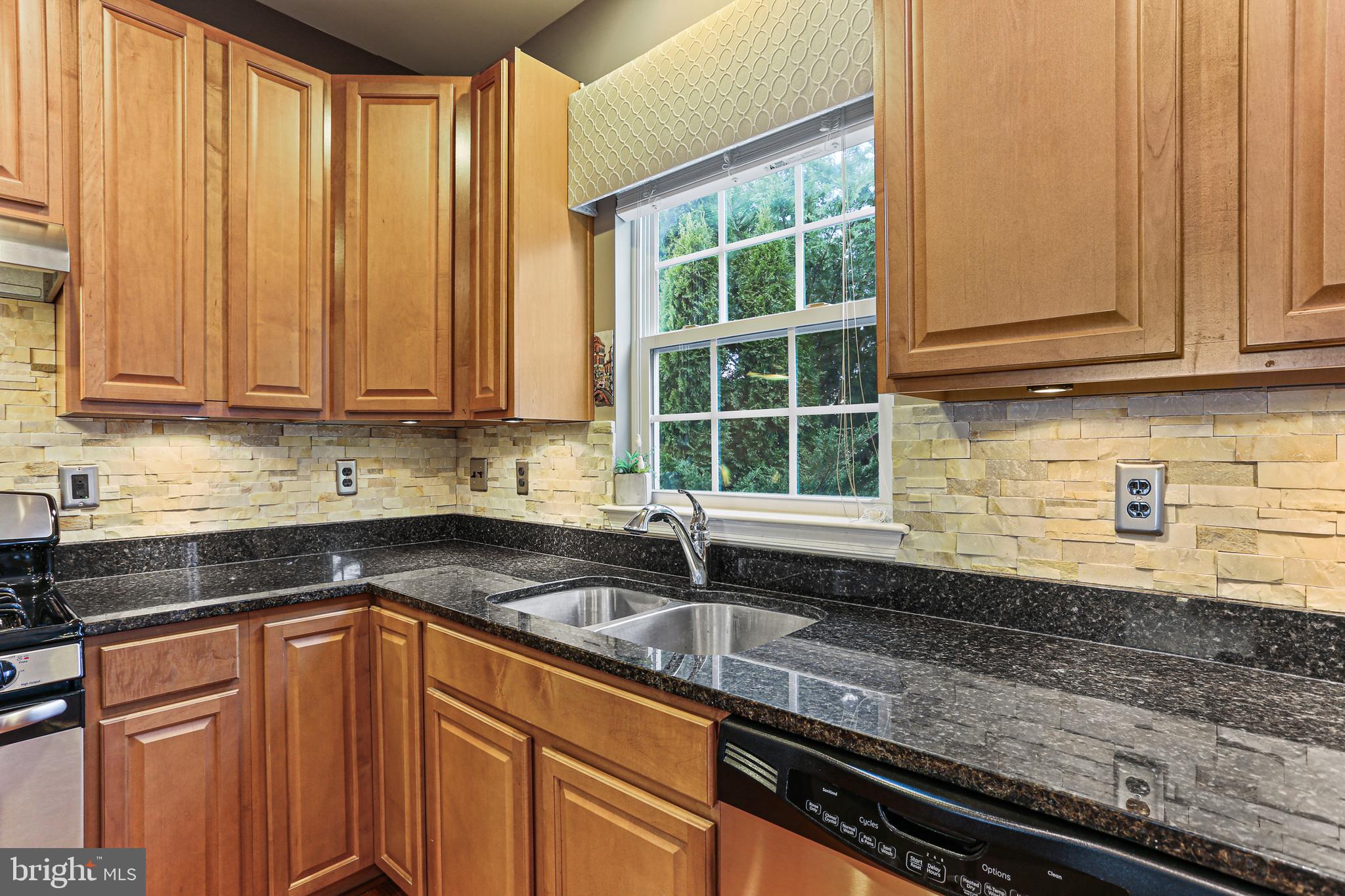 1122 Sassafras Circle Eldersburg, MD 21784 - Photo 10 of 40 Granite countertops and tile backsplash