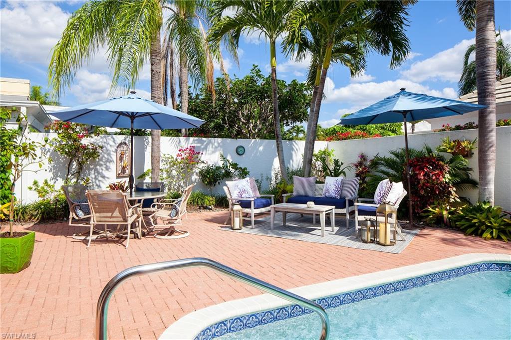 807 Rue Deville, Unit 2 11 Naples, FL 34108 - Photo 3 of 5 Privacy wall around outdoor living.