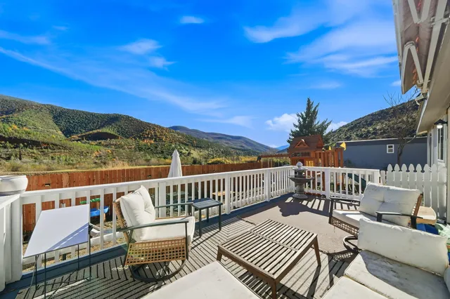 a view of balcony with furniture